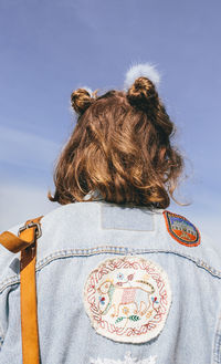 Low angle view of woman against sky