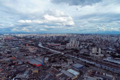 High angle view of city buildings against sky