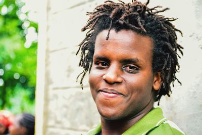 Close-up portrait of smiling young man