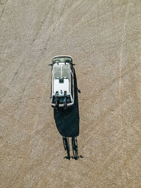 High angle view of van on dry desert lake bed