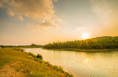 Scenic view of lake against sky during sunset