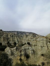 Scenic view of rock formations against sky