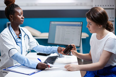 Doctor working at table