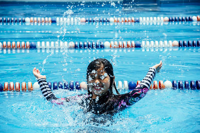 People swimming in pool