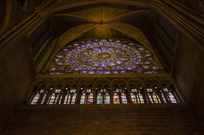 Low angle view of stained glass window in temple