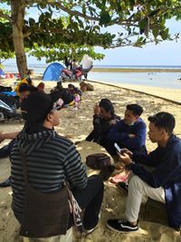 Group of people sitting outdoors