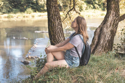 Young woman sitting on field