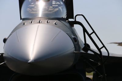 Close-up of airplane against sky