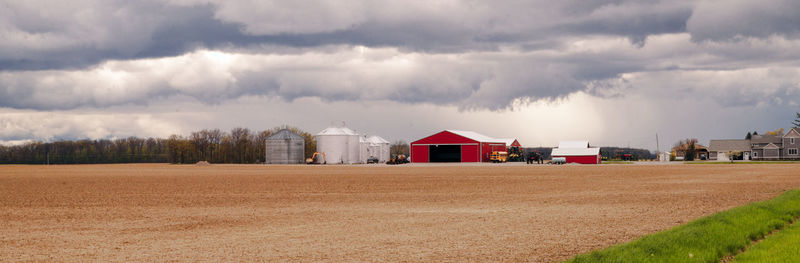 House on field against sky