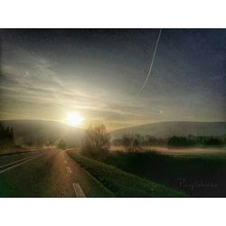 Country road passing through landscape