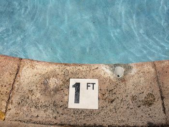 High angle view of number 1 at poolside