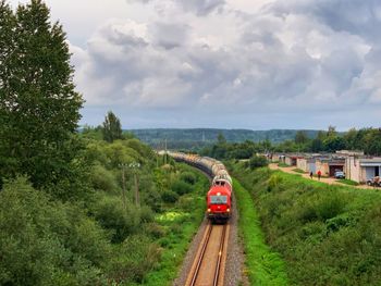 Train on railroad track against sky