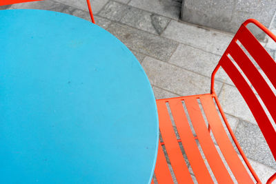 High angle view of blue table by chair at cafe