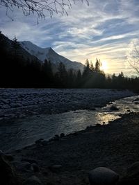 Scenic view of lake against sky during winter