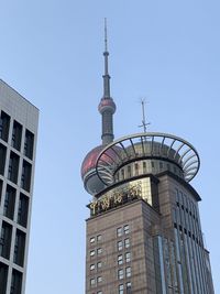 Low angle view of building against blue sky