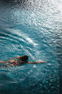 High angle view of man swimming in sea