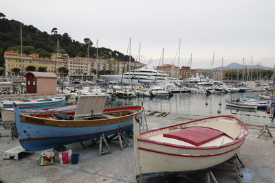 Boats moored at harbor