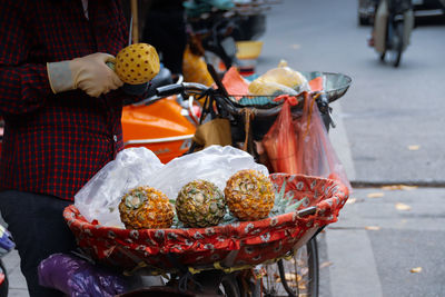 Various fruits in basket on street