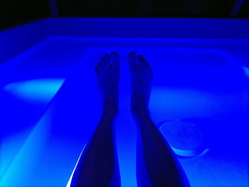 Low section of person in swimming pool