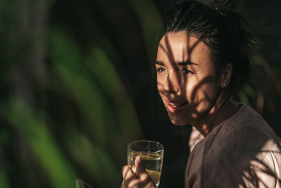 Close-up portrait of a man drinking glass