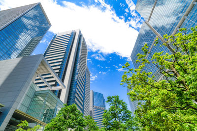 Low angle view of modern buildings against sky