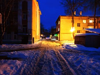 Snow covered city at night