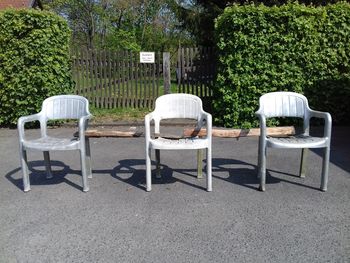 Empty chairs and tables in park