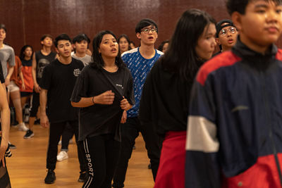 Group of people standing against wall