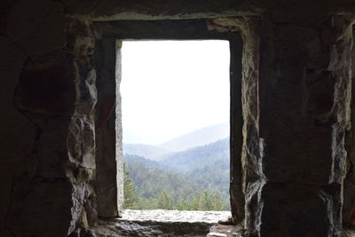 View of old building through window