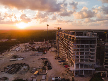 High angle view of street against sky at sunset