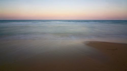 Scenic view of sea at sunset