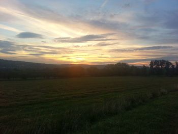 Scenic view of landscape at sunset