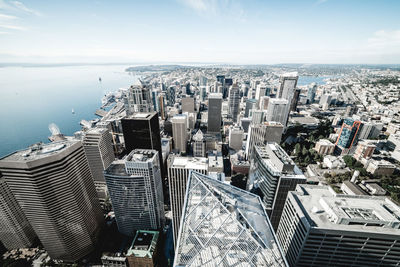 High angle view of modern buildings in city against sky