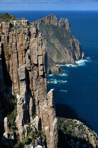 Dolerite sea cliffs against sea and sky on the tasman peninsula, tasmania