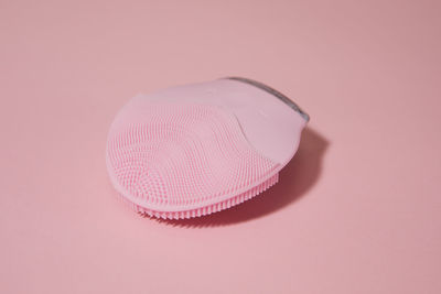 High angle view of pink umbrella on table
