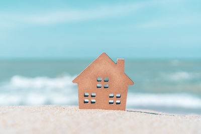 Built structure on beach against sky