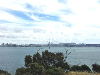 Scenic view of sea against cloudy sky