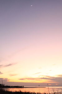 Scenic view of sea against sky at sunset