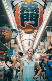 Portrait of smiling young people at amusement park