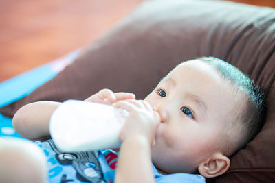 Portrait of cute boy drinking water