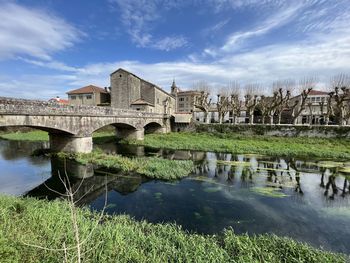 Bridge over river against sky