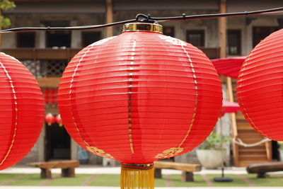 Close-up of red lanterns hanging in temple