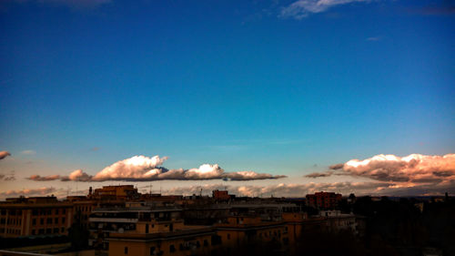 City buildings against blue sky
