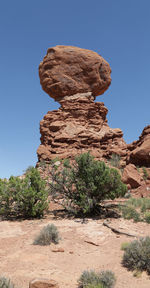 Rock formations against clear blue sky