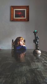 Portrait of smiling woman standing on floor at home