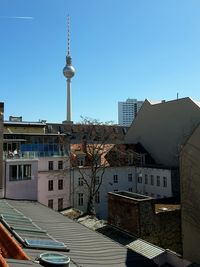 View of communications tower in city