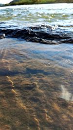 High angle view of water flowing in sea