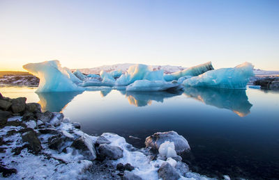 Scenic view of frozen lake against sky