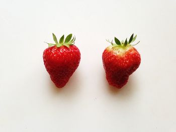 Close-up of strawberry over white background