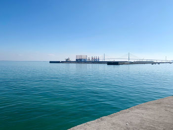 Scenic view of sea against clear blue sky